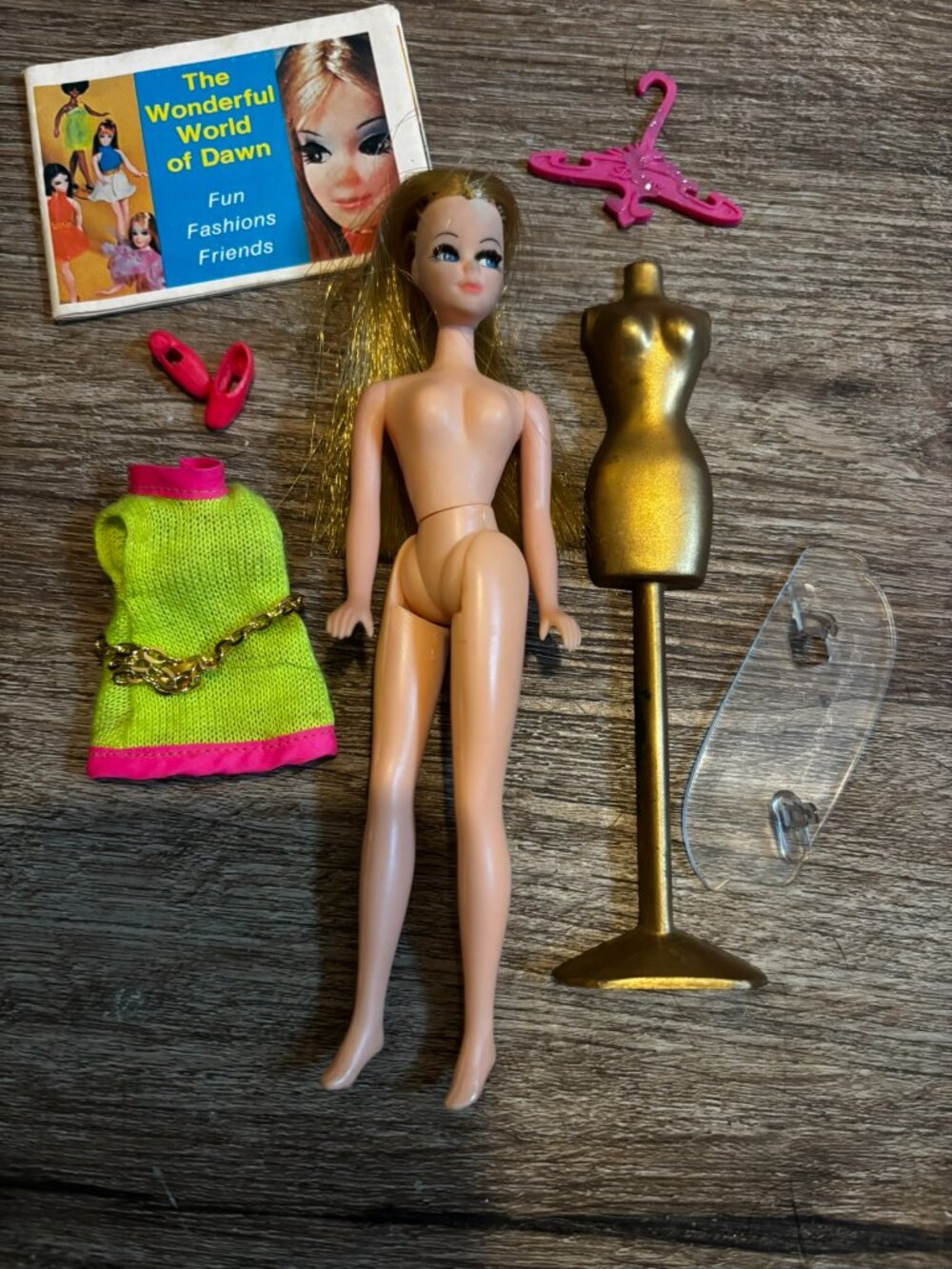 Topper Dawn Fancy Feet doll wearing lime green and pink hard straight legs